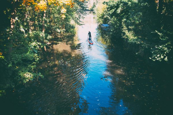 Man is paddle boarding 