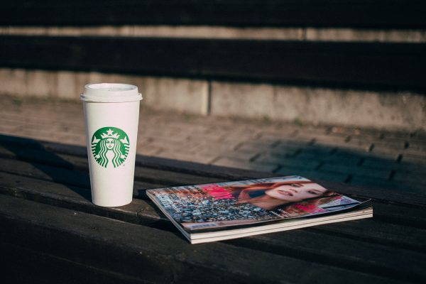 coffee_and_a_magazine_on_a_bench
