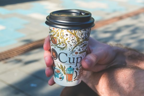 hand holding cup of coffee