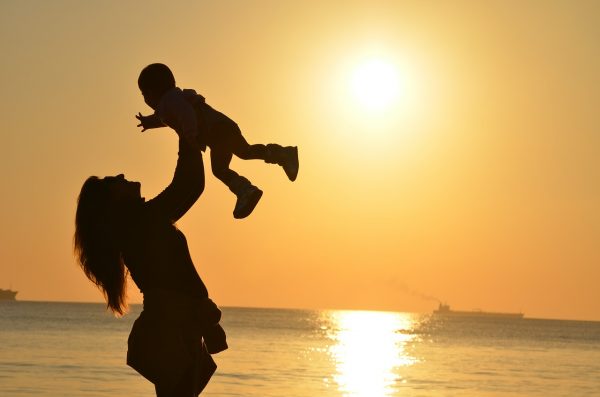 mother and a child in sunset